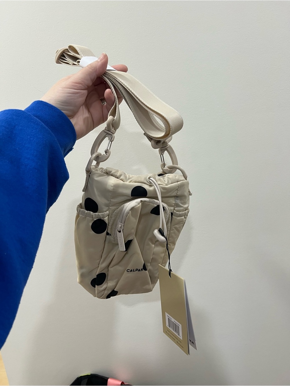 Calpak Beige Polka Dot Crossbody water bottle Bag